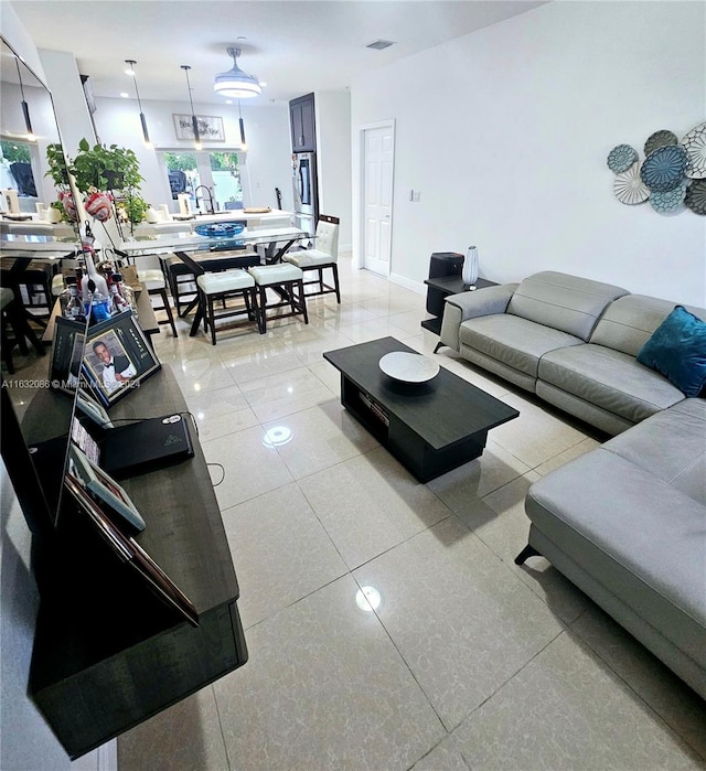 living room featuring light tile patterned floors