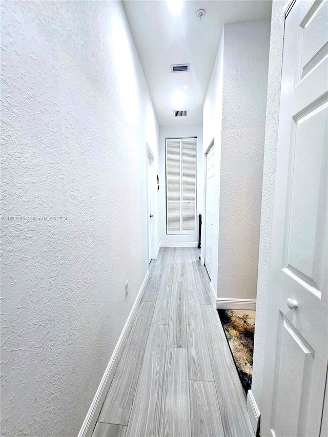 hallway featuring light hardwood / wood-style flooring