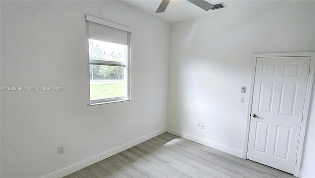 unfurnished room with ceiling fan and light hardwood / wood-style floors