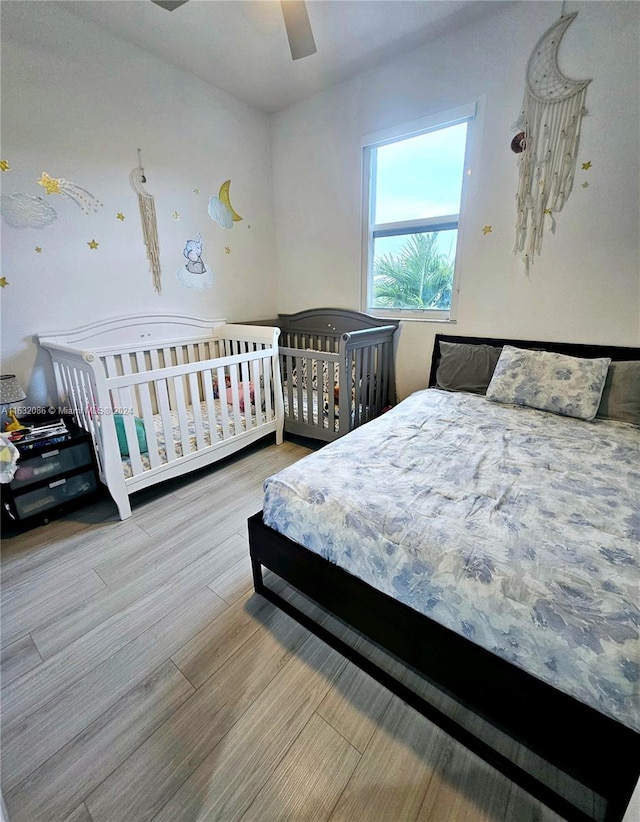 bedroom featuring ceiling fan and wood-type flooring