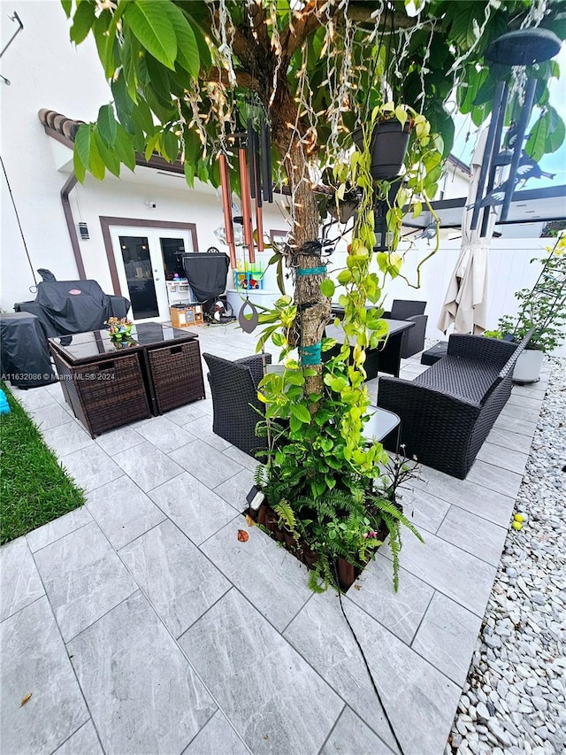 view of patio featuring french doors and an outdoor living space