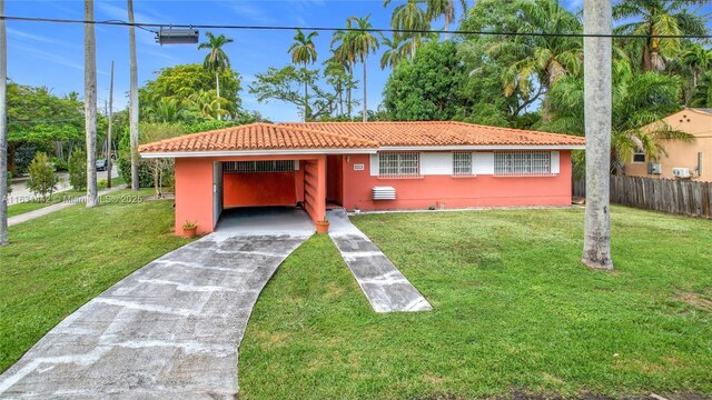 single story home with a front lawn