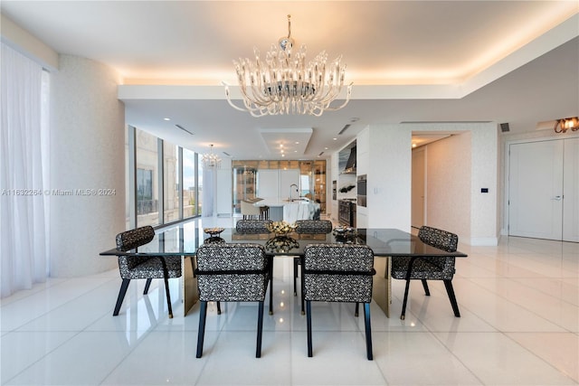 tiled dining area featuring a notable chandelier