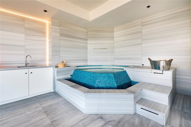 bathroom featuring tile walls and vanity