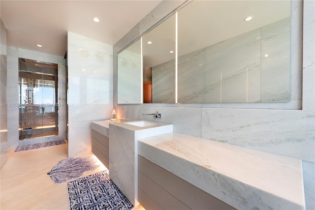 bathroom with tile walls and vanity