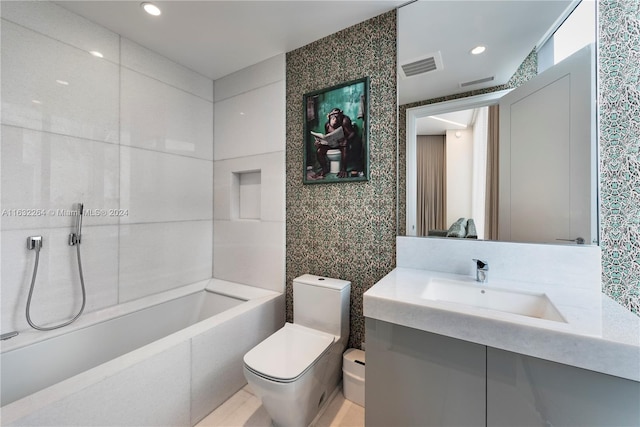 bathroom with vanity, toilet, and tile walls