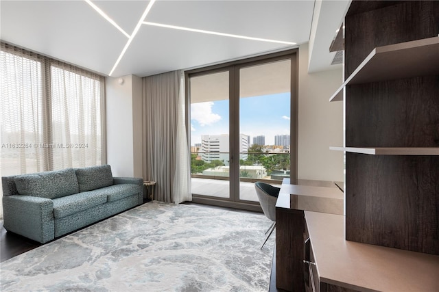 unfurnished living room featuring a wall of windows