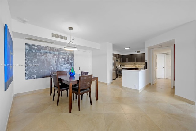 dining area with light tile patterned floors