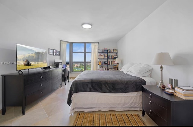 tiled bedroom featuring expansive windows