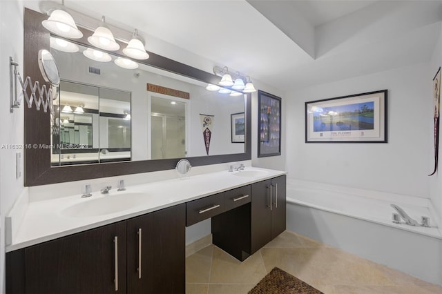 bathroom with plus walk in shower, dual vanity, and tile patterned floors