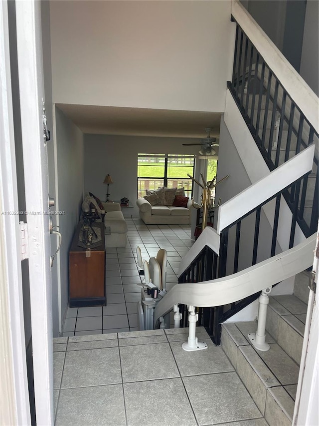 interior space featuring tile patterned flooring and ceiling fan