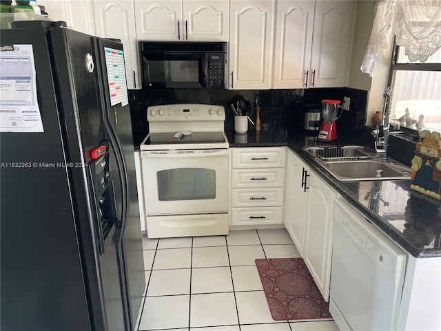 kitchen featuring tasteful backsplash, light tile patterned floors, white cabinets, black appliances, and sink