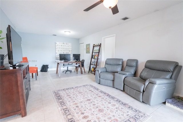 living room featuring ceiling fan and light tile patterned flooring