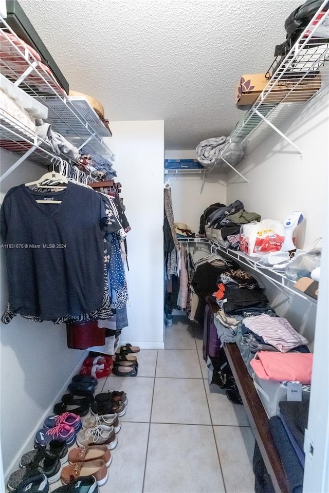 spacious closet with tile patterned flooring