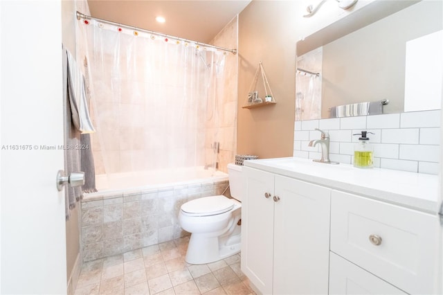 full bathroom featuring decorative backsplash, toilet, tile patterned flooring, shower / bath combo with shower curtain, and vanity