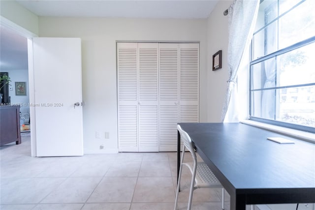 unfurnished office with light tile patterned floors