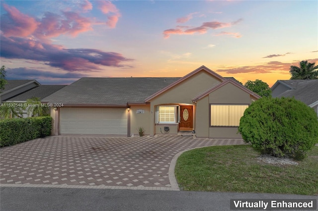 ranch-style home featuring a garage