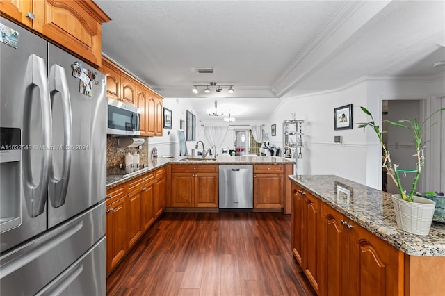 kitchen with ornamental molding, sink, dark hardwood / wood-style flooring, and stainless steel appliances