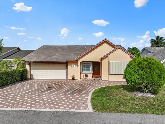 single story home featuring a garage