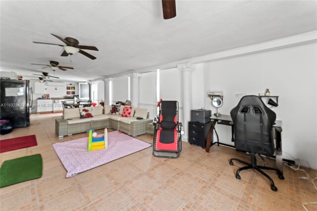 interior space featuring ornate columns and ceiling fan