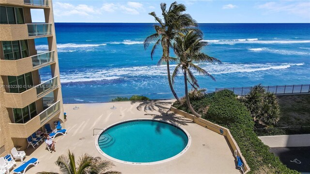 view of pool with a water view