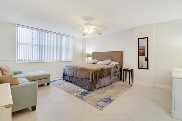 tiled bedroom with ceiling fan