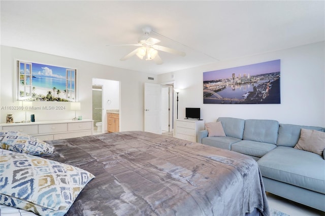 bedroom with ceiling fan and connected bathroom