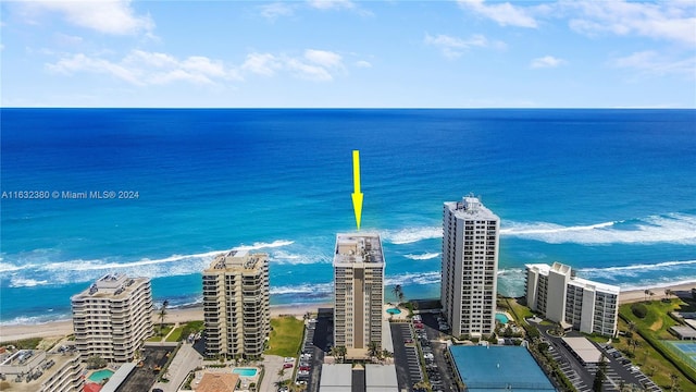 bird's eye view with a view of the beach and a water view