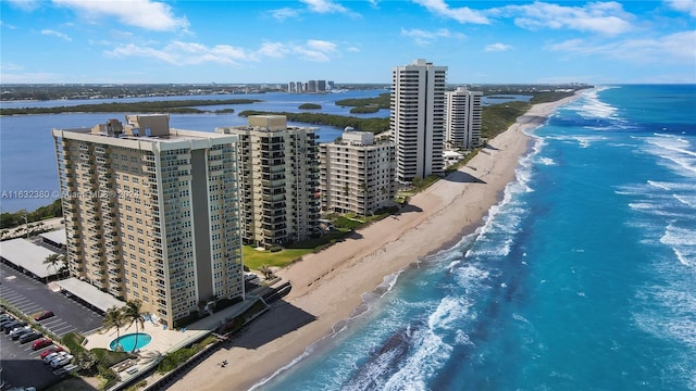 birds eye view of property featuring a view of the beach and a water view