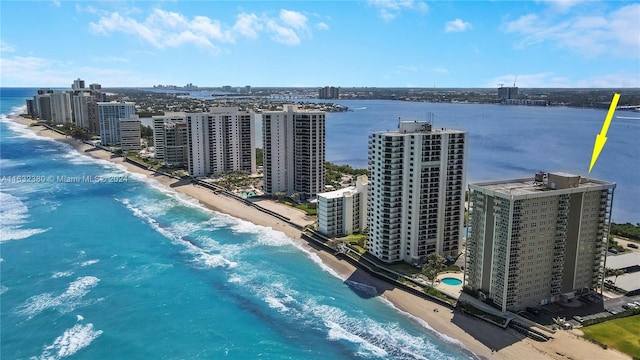 bird's eye view featuring a water view and a view of the beach