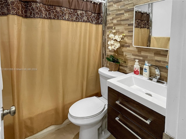 bathroom with vanity, decorative backsplash, toilet, and tile patterned flooring