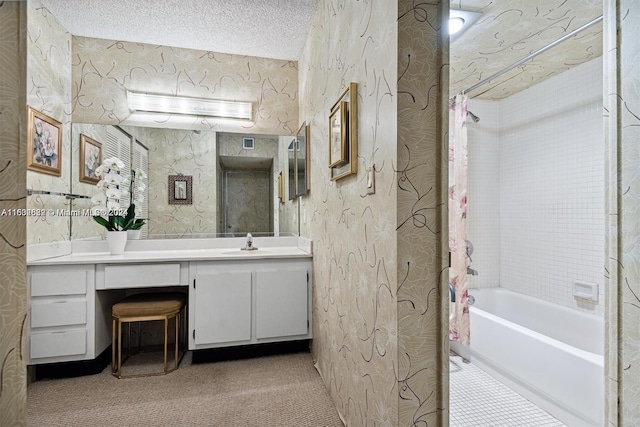 bathroom featuring vanity, a textured ceiling, and shower / bath combination with curtain