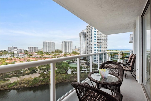 balcony featuring a water view