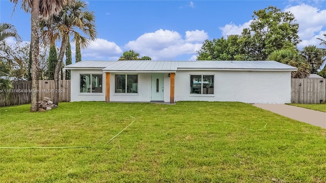 ranch-style home with a front yard