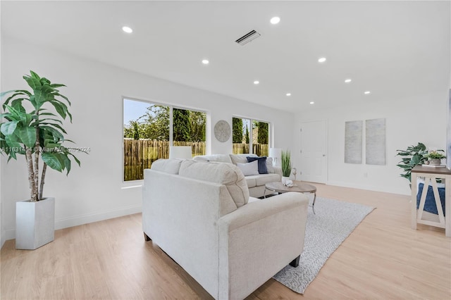 living room with light hardwood / wood-style floors