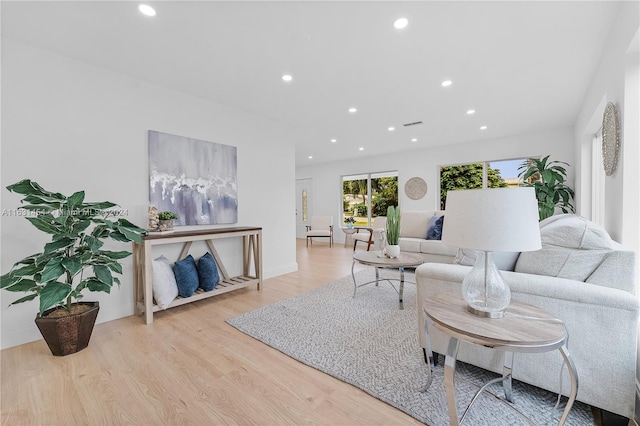 living room with light hardwood / wood-style floors