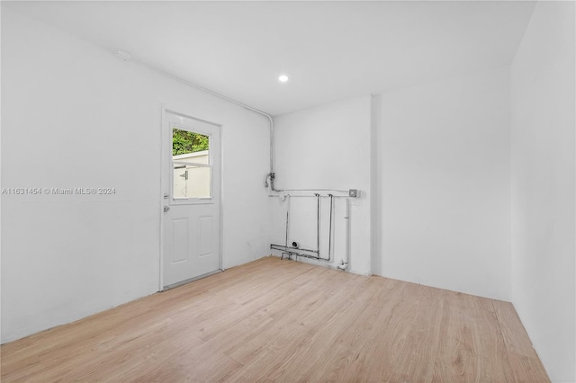 spare room with light hardwood / wood-style flooring