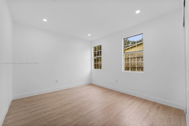 spare room featuring hardwood / wood-style flooring