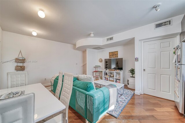 living room with light hardwood / wood-style flooring