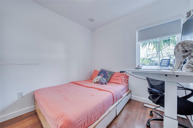 bedroom featuring wood-type flooring