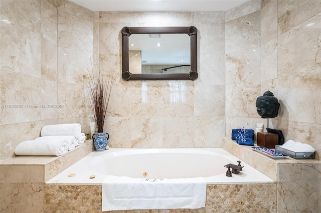 bathroom featuring tile walls and tiled tub