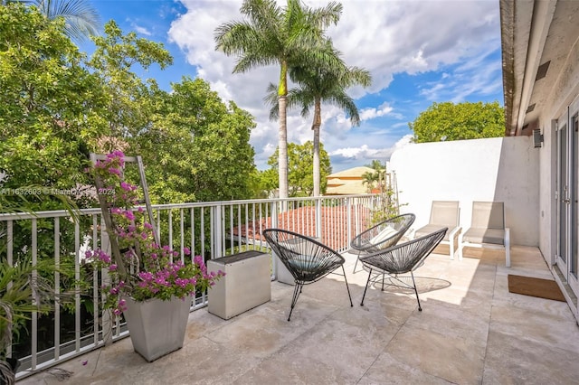 view of patio / terrace with a balcony