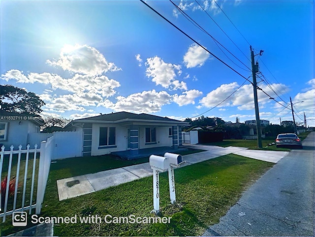 view of front of property with a front lawn