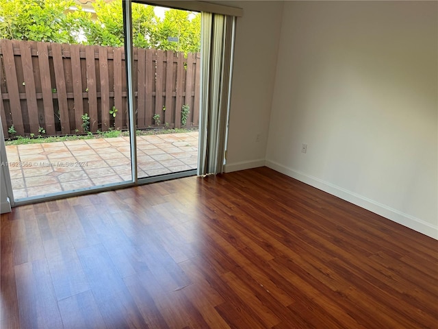 unfurnished room featuring wood-type flooring