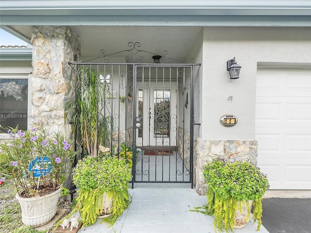 doorway to property featuring a garage