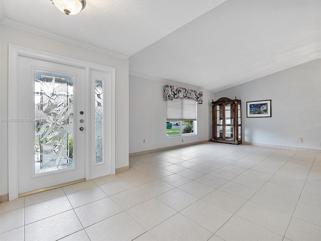 foyer entrance featuring light tile patterned floors, plenty of natural light, a textured ceiling, and vaulted ceiling