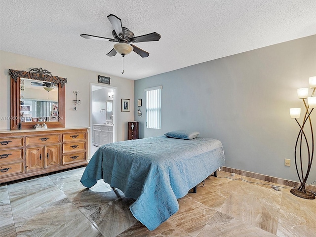 bedroom with connected bathroom, a textured ceiling, and ceiling fan