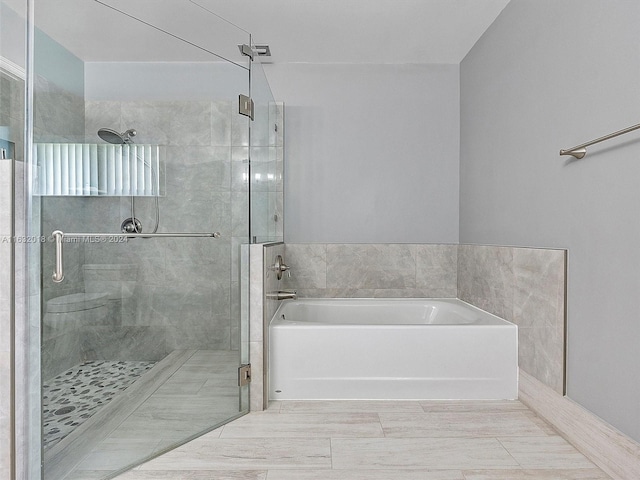 bathroom with independent shower and bath