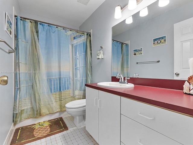 bathroom with vanity, tile patterned floors, and toilet