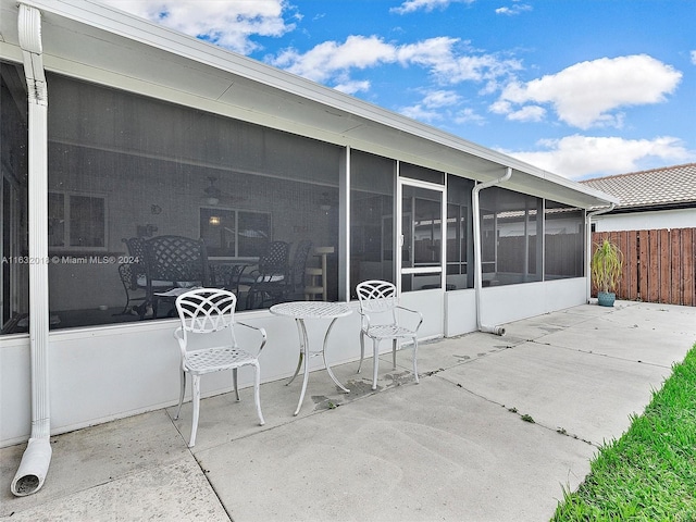 view of patio with a sunroom